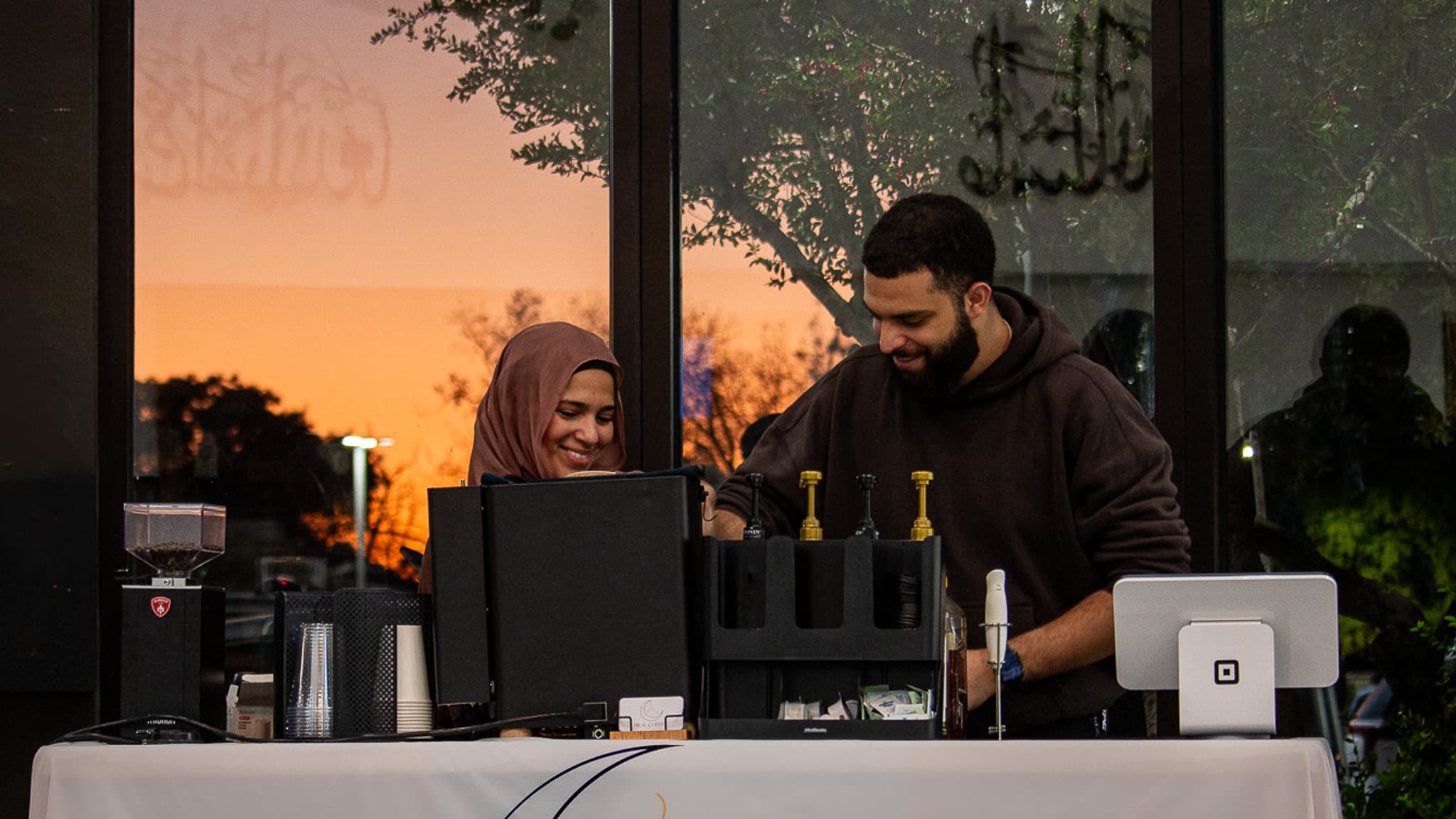 Hilal Coffee's founders running the mobile cart at an event