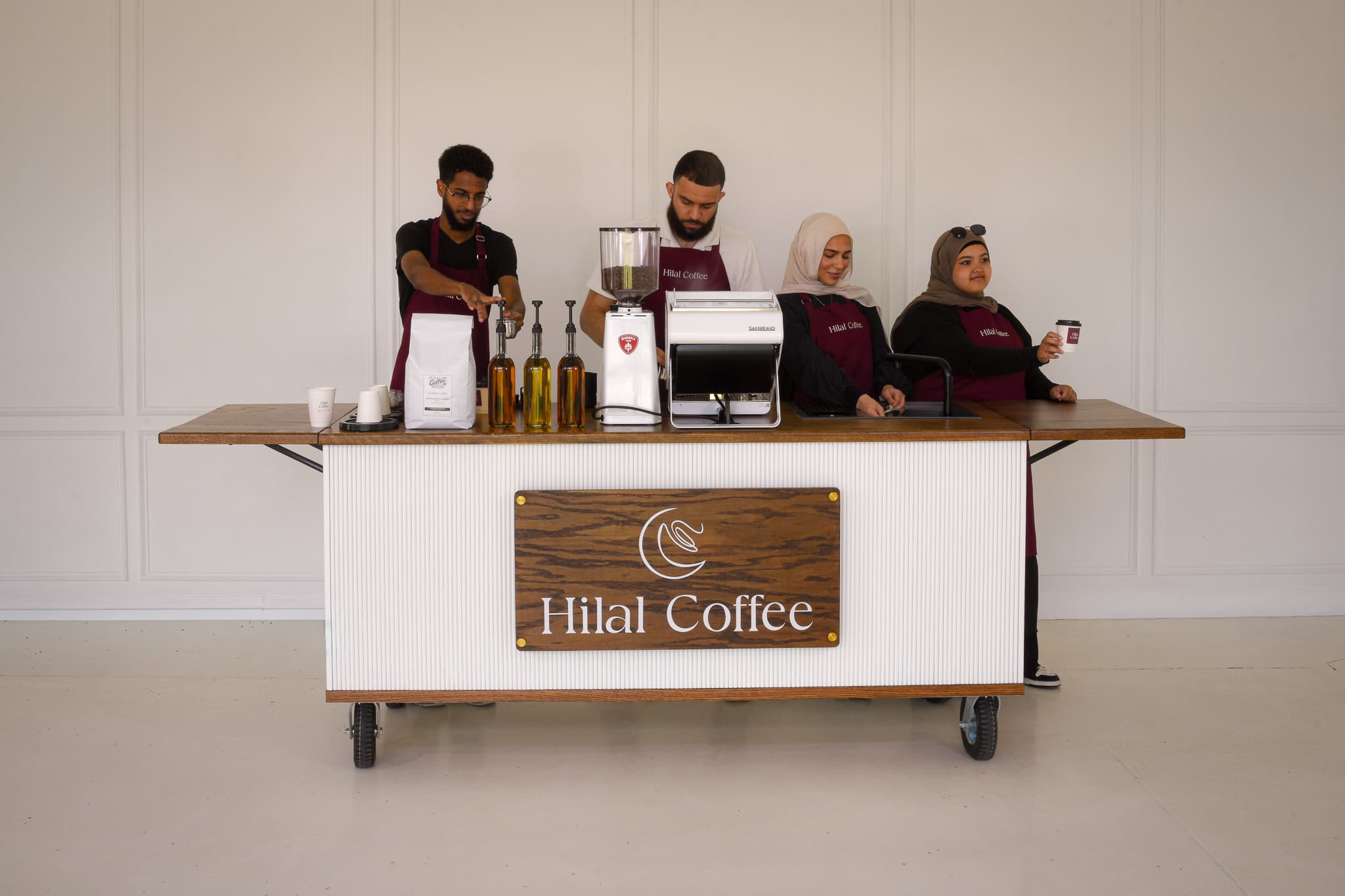 The Hilal Coffee barista team at the mobile cart